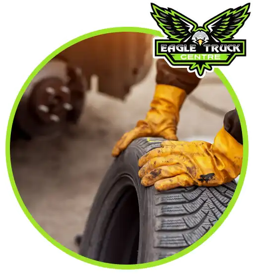 Mobile tyre technician repairing a truck tyre